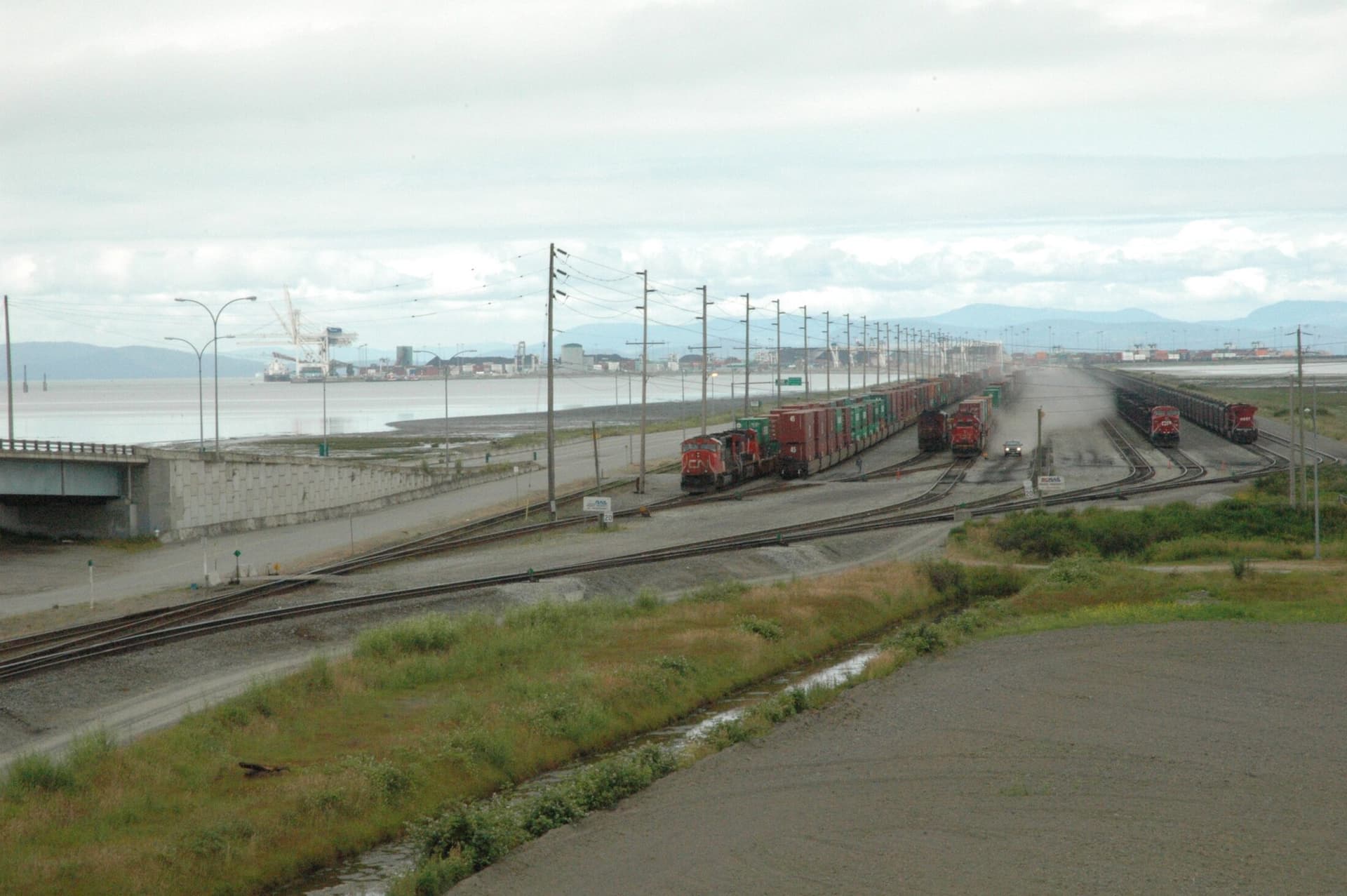 Rail tracks and freight cars on the causeway to Deltaport, Roberts Bank.