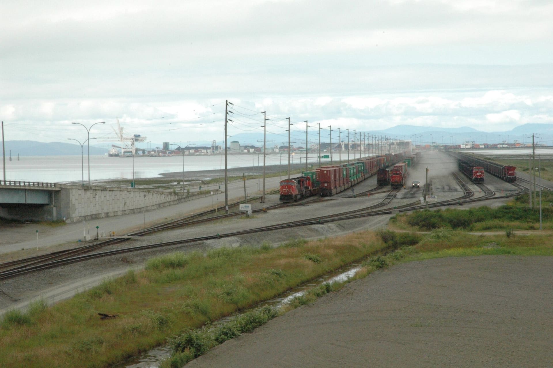 Rail tracks and freight cars on the causeway to Deltaport, Roberts Bank.