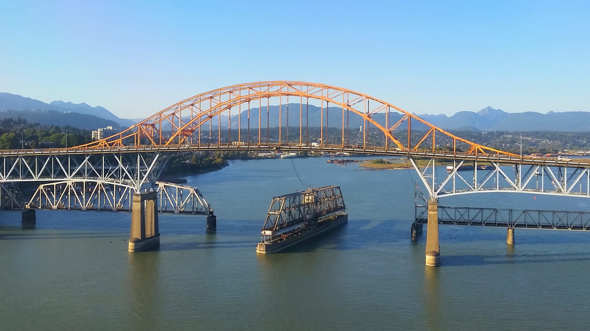 The Pattullo and New Westminster rail bridges crossing the Fraser River.