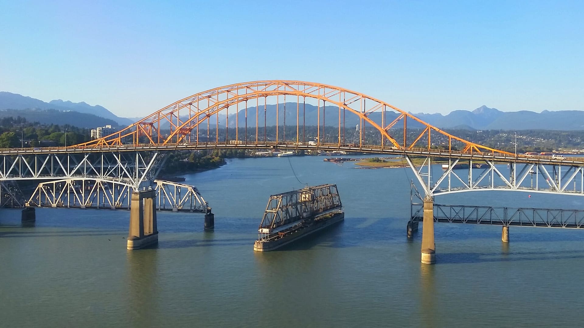 The Pattullo and New Westminster rail bridges crossing the Fraser River.