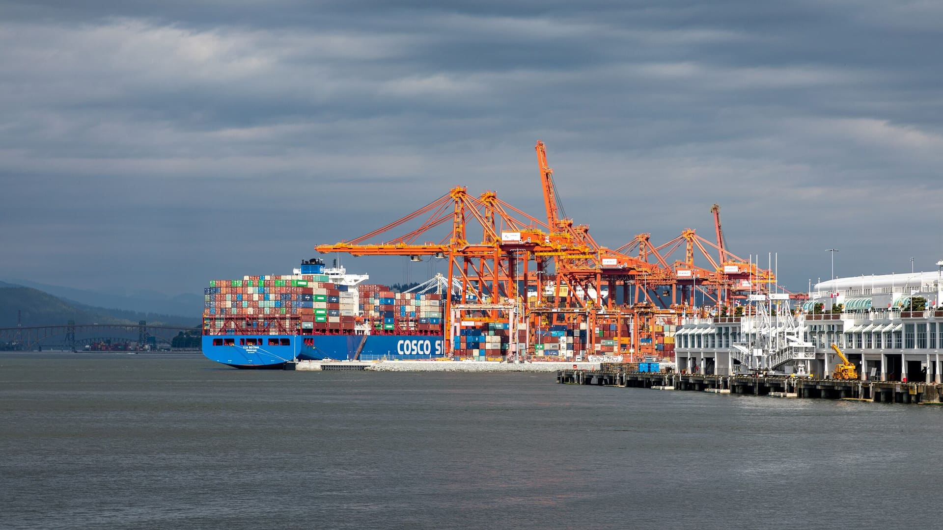 Gantry cranes loading a container ship at the Centerm terminal, Port of Vancouver.