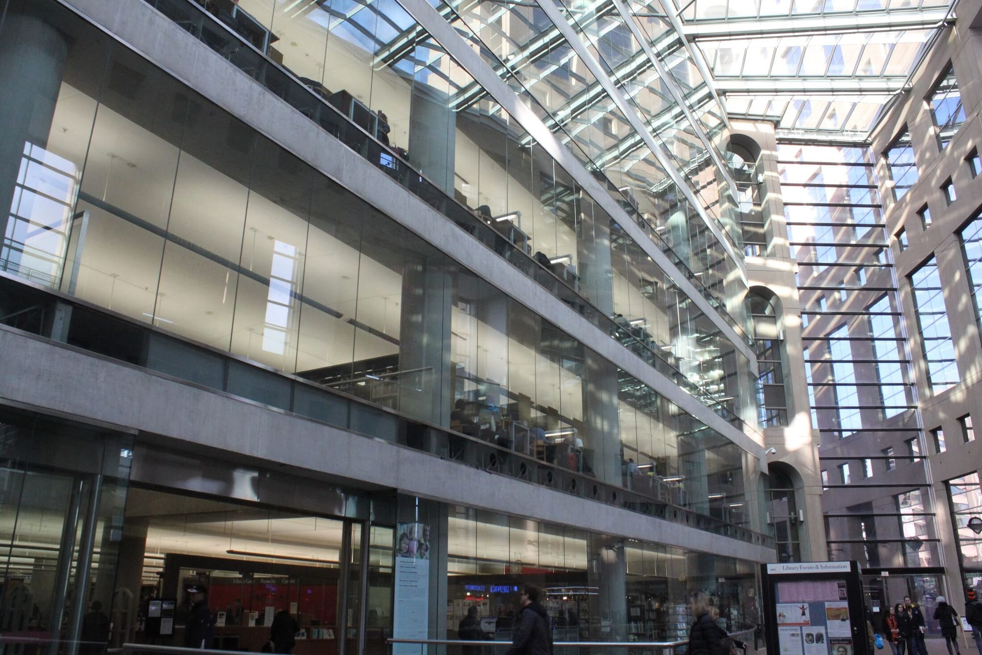 The glass-roofed atrium of the Vancouver Public Library central branch.